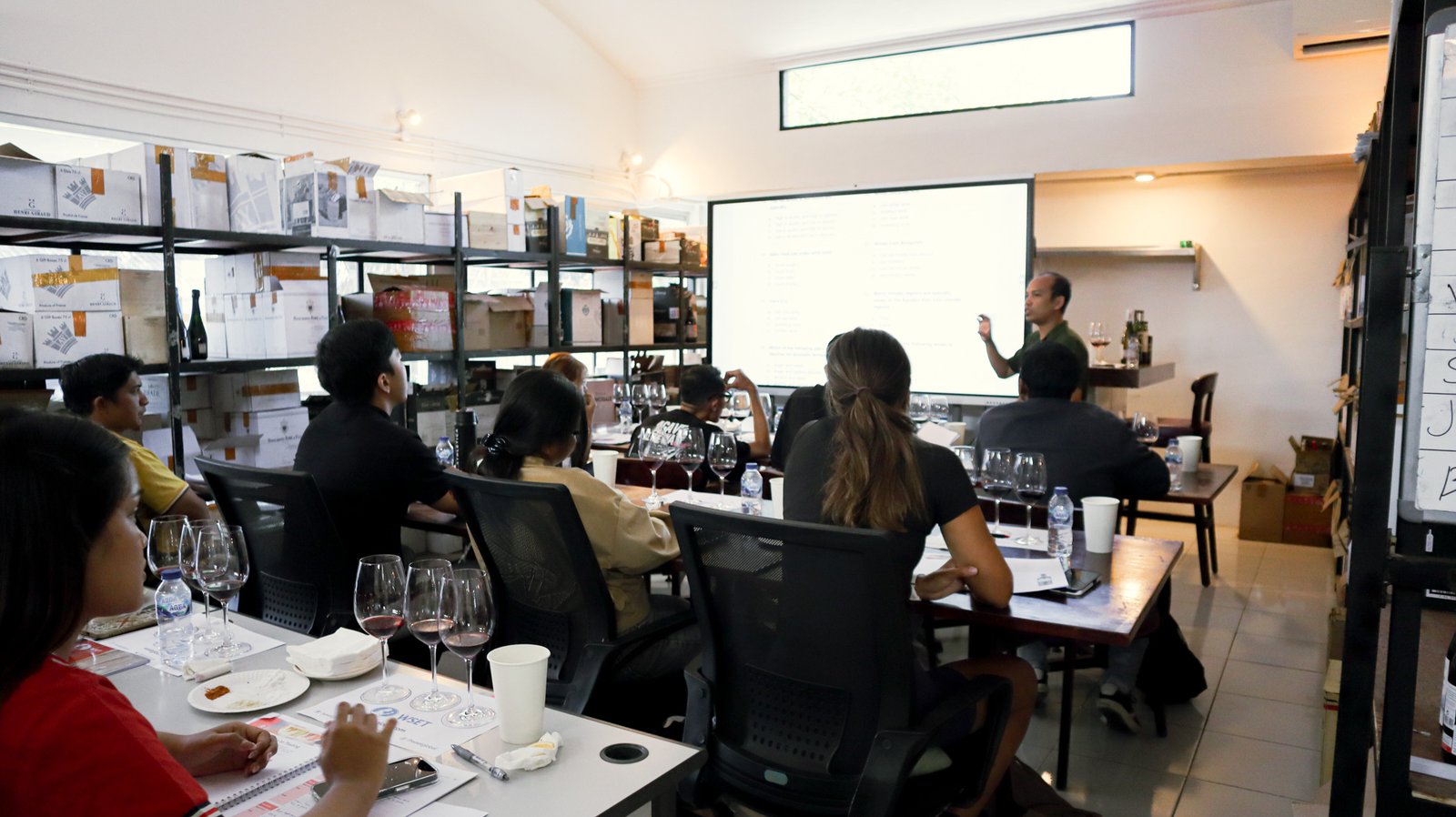 WSET students tasting wines during guided classroom activity